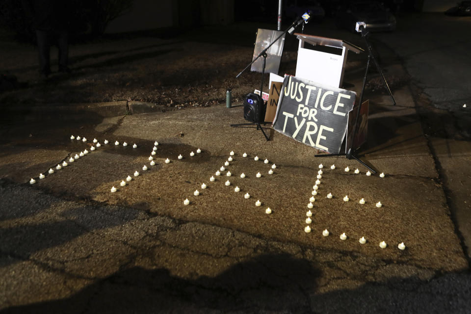 Candles spell out the name of Tyre Nichols during a candlelight vigil for Nichols on the anniversary of his death Sunday, Jan. 7, 2024, in Memphis, Tenn. Nichols lost his life following a violent beating by five Memphis Police Officers in January 2023. (AP Photo/Karen Pulfer Focht)