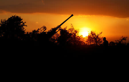 An anti-aircraft artillery emplacement is pictured during sunset near the venue of the upcoming Association of Southeast Asian Nations (ASEAN) summit in Manila, Philippines April 26, 2017. REUTERS/Erik De Castro