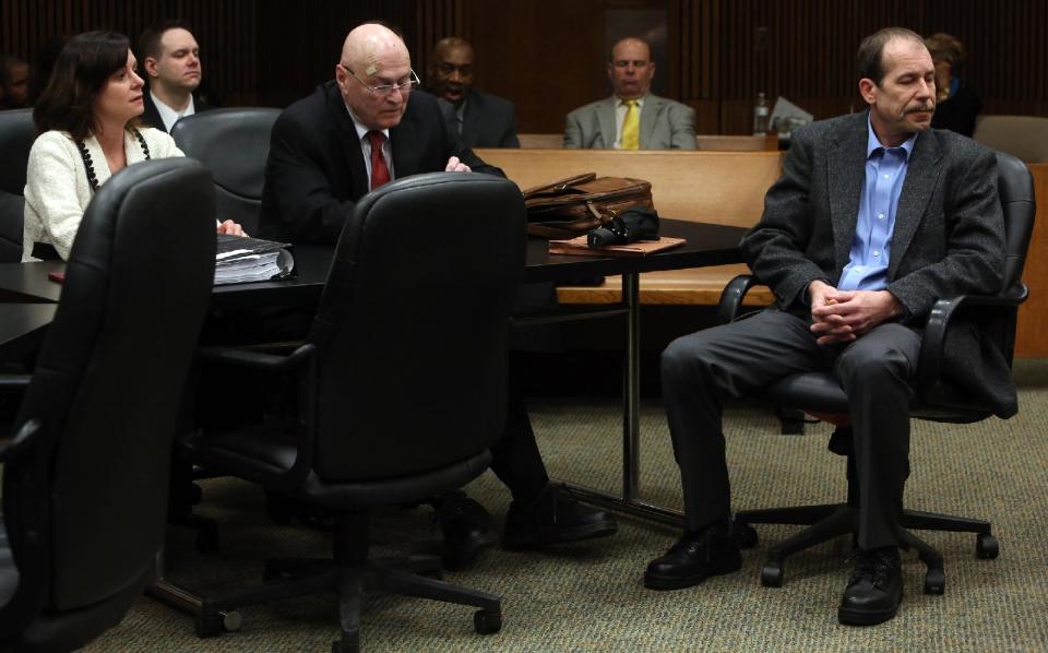 Theodore Wafer, right, listens during a motion hearing in Judge Timothy Kenny's courtroom at the Frank Murphy Hall of Justice in Detroit, Friday, April 25, 2014. Wafer has been accused of fatal shooting 19-year-old Renisha McBride on the porch of his home. Kenny removed Judge Qiana Lillard on Friday from the case of Wafer. Defense attorneys argued Lillard's previous employment with the prosecutor's office and associations with employees created an appearance of impropriety. (AP Photo/Detroit Free Press, Eric Seals) DETROIT NEWS OUT; NO SALES