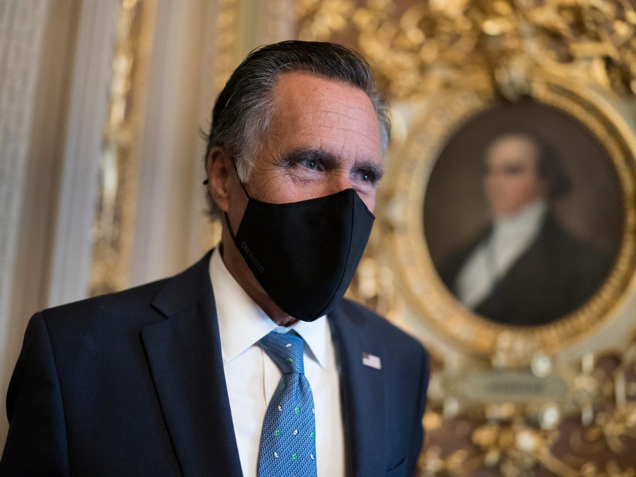 <p>Mitt Romney, R-Utah, pauses to answer questions from reporters as senators arrive to vote on President Joe Biden’s nominee for United Nation’s ambassador, Linda Thomas-Greenfield, at the Capitol in Washington, on Tuesday 23 February 2021</p> ((Associated Press))