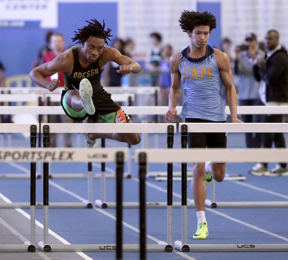 Odessa's Michael Latham (left) clears a hurdle en route to a first place finish in the 55 meter hurdles during the DIAA indoor track and field championships at the Prince George's Sports and Learning Complex in Landover, Md., Saturday, Feb. 3, 2024. Fourth-place finisher Robert Redden of Cape Henlopen races at right.