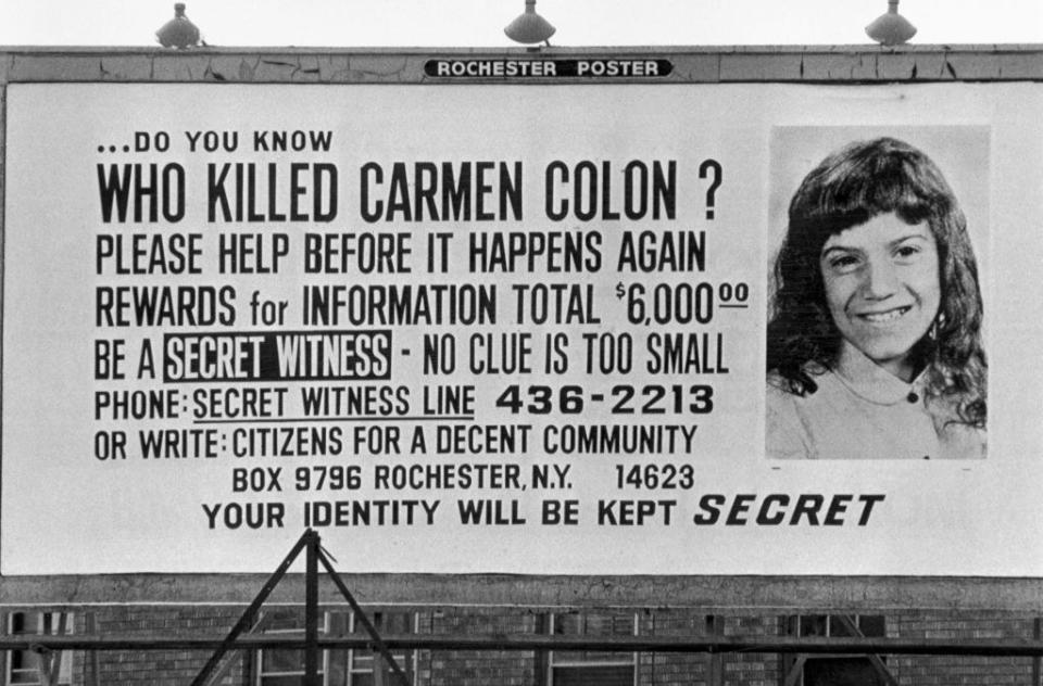 A "Who Killed Carmen Colon?" sign