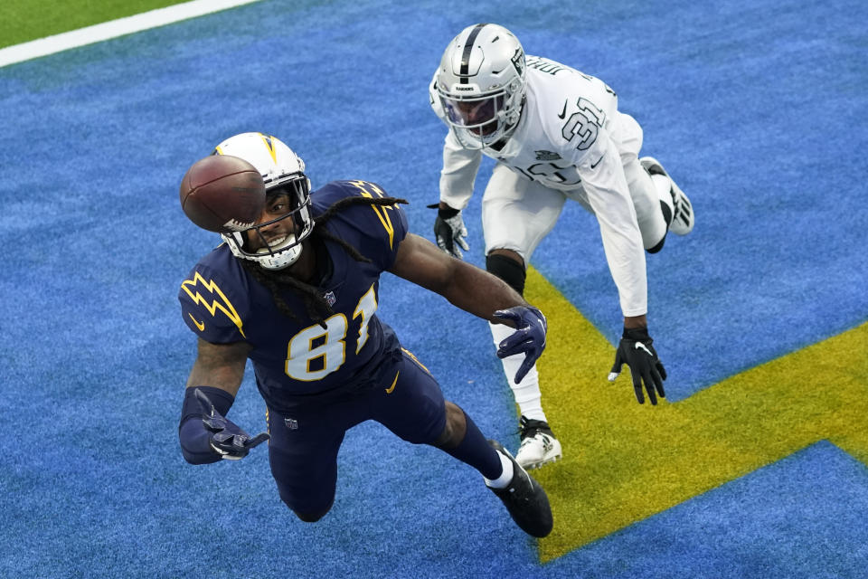 Los Angeles Chargers wide receiver Mike Williams, left, cannot make an end zone catch as Las Vegas Raiders cornerback Isaiah Johnson defends during the second half of an NFL football game Sunday, Nov. 8, 2020, in Inglewood, Calif. (AP Photo/Ashley Landis)