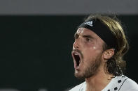 Greece's Stefanos Tsitsipas shouts as he defeats Zdenek Kolar of the Czech Republic during their second round match of the French Open tennis tournament at the Roland Garros stadium Thursday, May 26, 2022 in Paris. (AP Photo/Michel Euler)