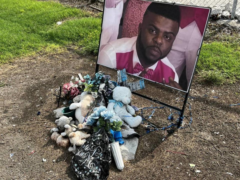 A roadside memorial honors Toshorn Napper, who was killed in 2020 while stopped at a Sauget railroad crossing, where his SUV was rear-ended by another vehicle. The crossing was the site of a train crash on Saturday.