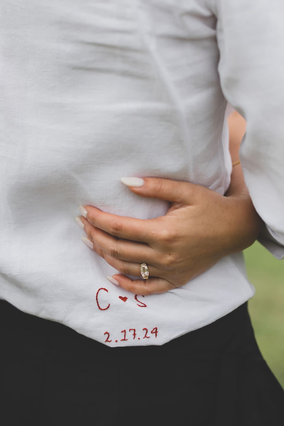 a woman's hand with a ring on her finger