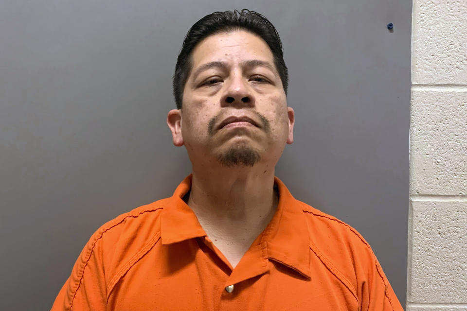 This booking image provided by Uvalde County, Texas, Sheriff's Office shows Adrian Gonzales, a former police officer for schools in Uvalde, Texas, who was arrested and booked into jail before he was released Friday, June 28, 2024, on 29 charges of abandoning or endangering a child in the May 24, 2022, attack that killed 19 children and two teachers. (Uvalde County Sheriff's Office via AP)