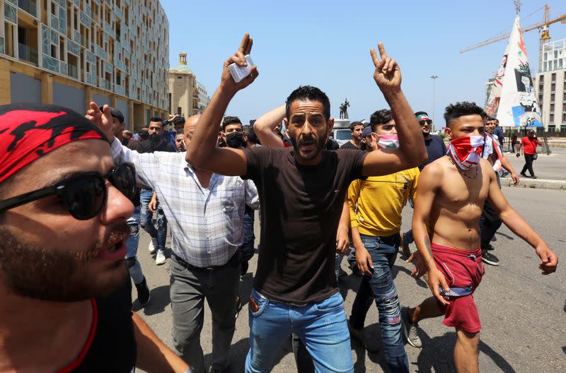 A demonstrator gestures during a protest against the government performance and worsening economic conditions, in Beirut