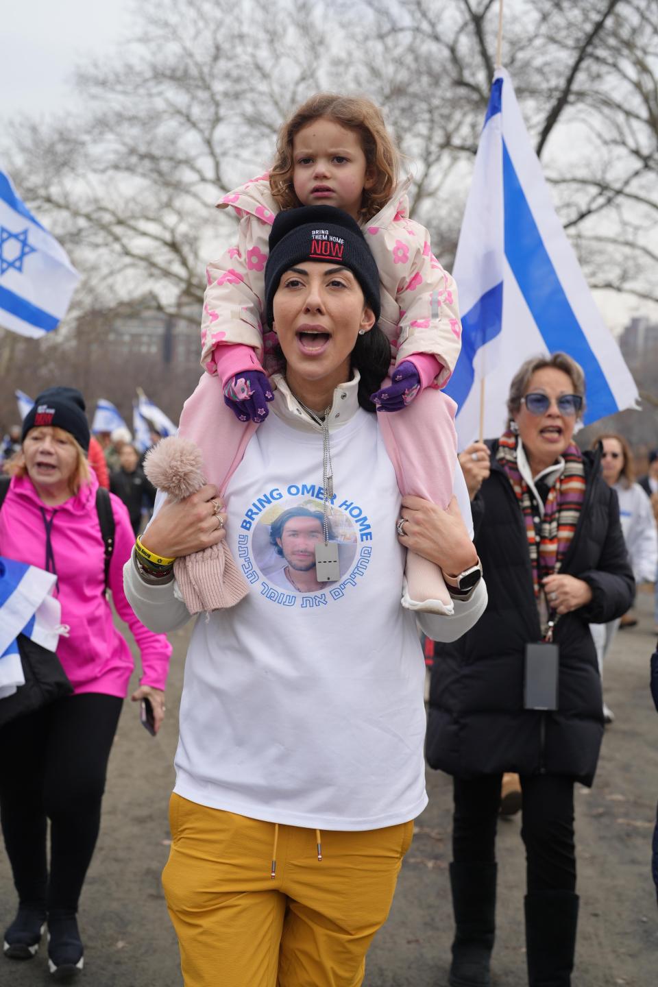 Leat Corrine Unger and her daughter march in a rally for the return of hostages held by Hamas in Gaza.