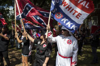 <p>The Ku Klux Klan protests the planned removal of a statue of Gen. Robert E. Lee, and calls for the protection of Confederate monuments. (Photo: Chet Strange/Getty Images) </p>