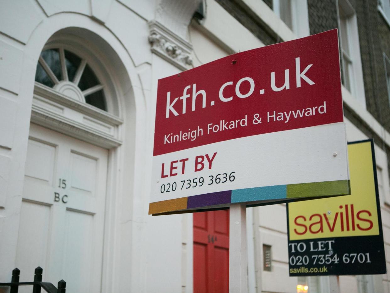 Letting signs on display outside properties in South Kensington, London: PA