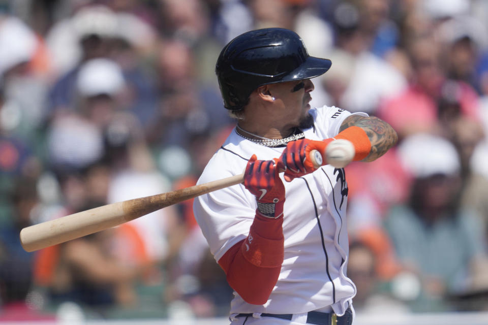 Detroit Tigers' Javier Baez is hit by a pitch against the Houston Astros in the second inning of a baseball game, Sunday, Aug. 27, 2023, in Detroit. (AP Photo/Paul Sancya)