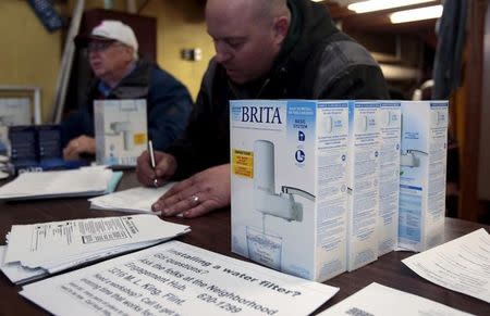 Water faucet filters are distributed to Flint residents at a distribution center in a fire station in Flint, Michigan January 13, 2016. The Federal Bureau of Investigation said on Tuesday it was joining a criminal investigation of lead-contaminated drinking water in Flint, Michigan, exploring whether laws were broken in a crisis that has captured international attention. Picture taken January 13, 2016. REUTERS/Rebecca Cook