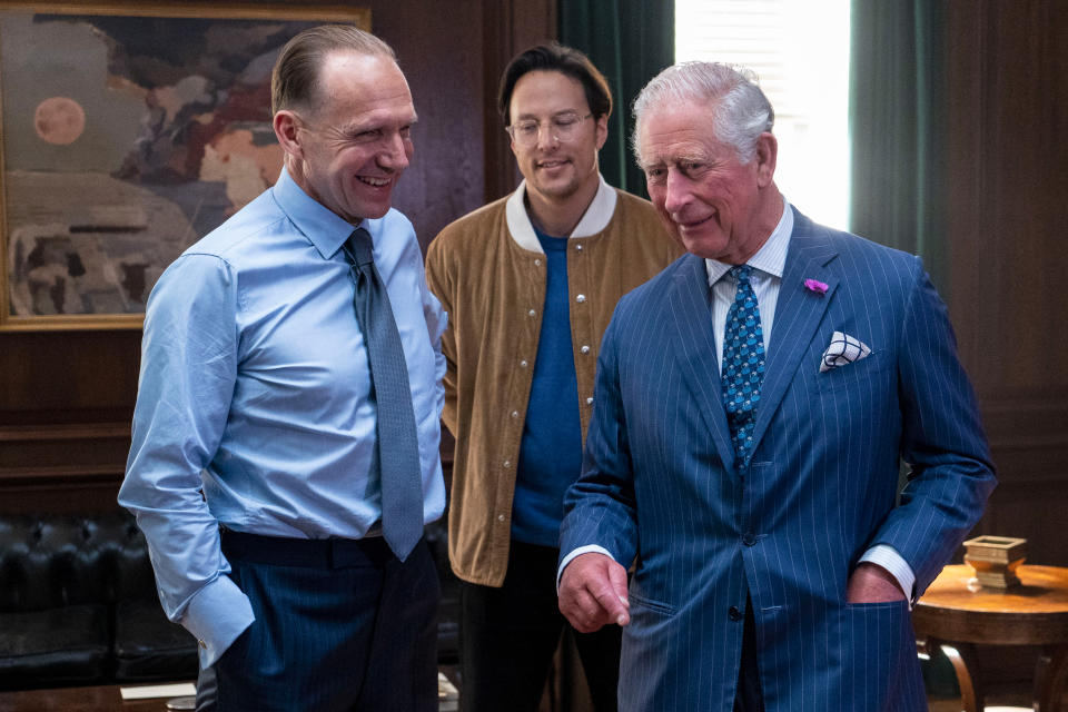 IVER HEATH, ENGLAND - JUNE 20: Prince Charles (R), Prince of Wales meets British actor Ralph Fiennes (L) and US Director Cary Joji Fukunaga as he tours the set of the 25th James Bond Film at Pinewood Studios on June 20, 2019 in Iver Heath, England. The Prince of Wales, Patron, The British Film Institute and Royal Patron, the Intelligence Services toured the set of the 25th James Bond Film to celebrate the contribution the franchise has made to the British film industry. (Photo by Niklas Halle'n - WPA Pool/Getty Images)