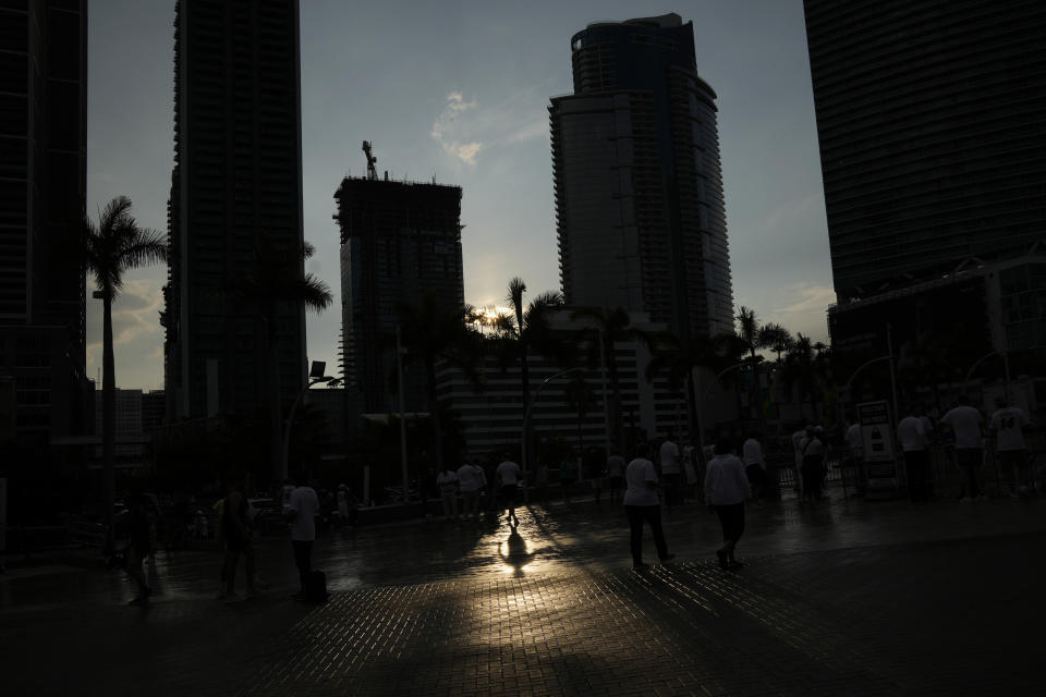 Fans arrive for Game 3 of the NBA Finals basketball game between the Miami Heat and the Denver Nuggets, Wednesday, June 7, 2023, in Miami. (AP Photo/Rebecca Blackwell)