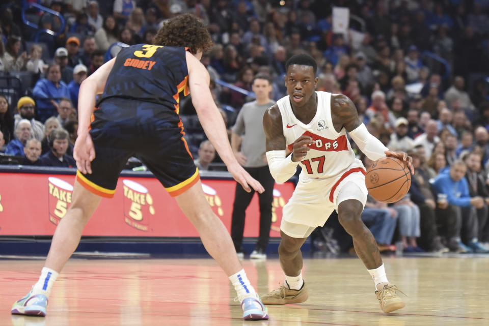 Toronto Raptors guard Dennis Schroder (17) looks for an opening past Oklahoma City Thunder guard Josh Giddey (3) in the second half of an NBA basketball game, Sunday, Feb. 4, 2024, in Oklahoma City. (AP Photo/Kyle Phillips)