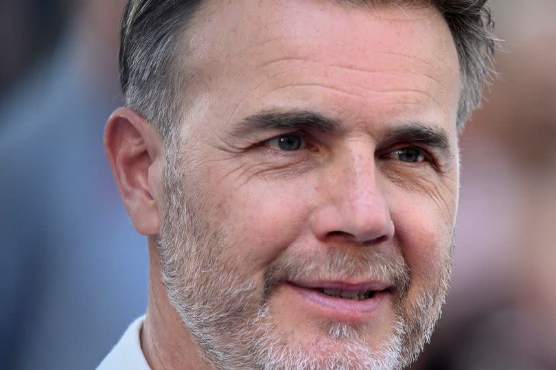 Gary Barlow's likeness was used by a Nigerian scammer. (Photo by Gareth Cattermole/Getty Images)