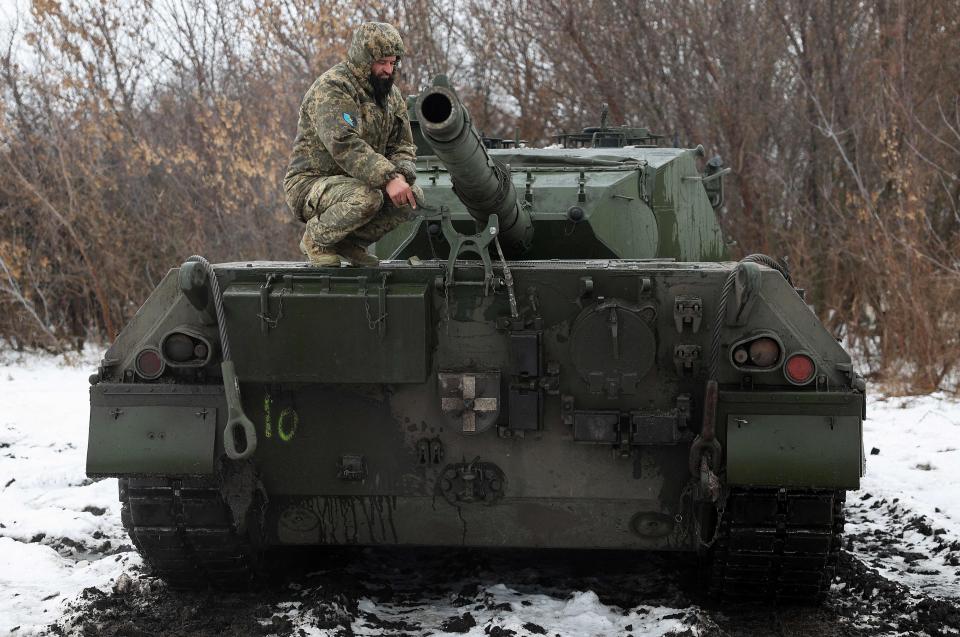 A Ukrainian tankist sits on a tank Leopard 1A5 not far from the front line in Kharkiv region (AFP via Getty Images)