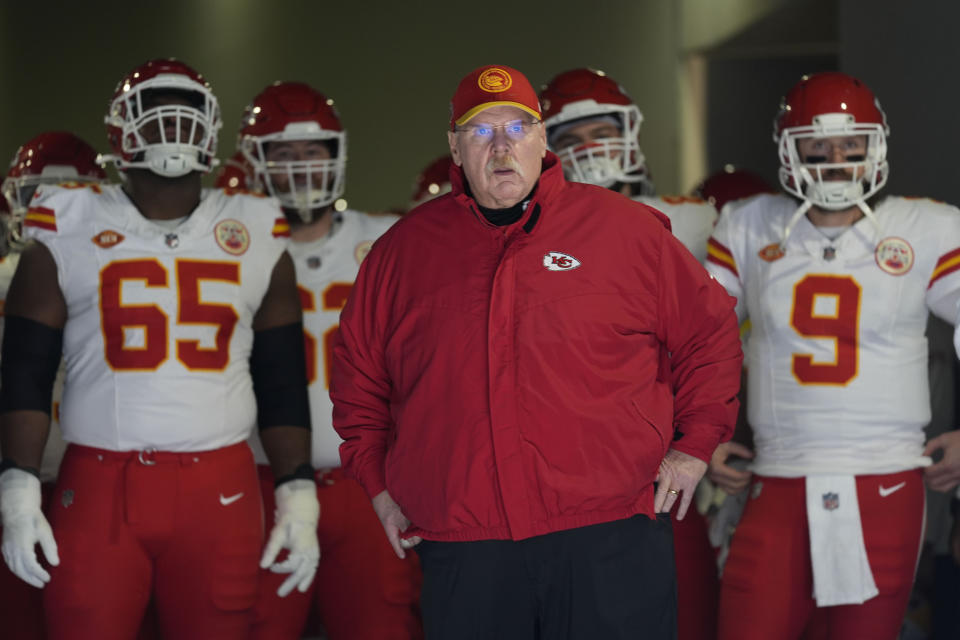 Kansas City Chiefs head coach Andy Reid, center, looks on before an NFL football game against the Los Angeles Chargers, Sunday, Jan. 7, 2024, in Inglewood, Calif. (AP Photo/Ashley Landis)