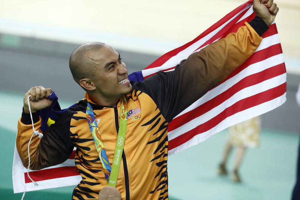 Malaysia's Azizulhasni Awang poses on the podium after winning a bronze medal in the men's keirin cycling event at the 2016 Rio de Janeiro Olympics.