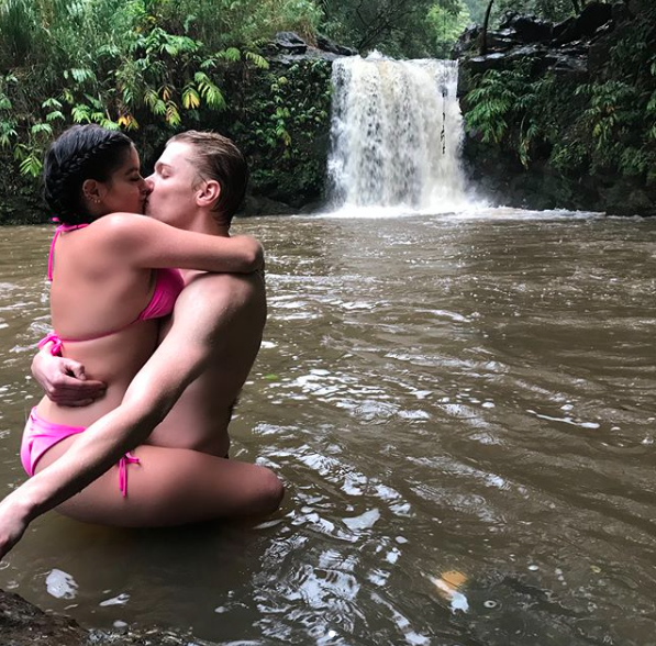 The racy pic was of the couple hugging and kissing under a waterfall with Ariel wearing a pink bikini. Source: Instagram