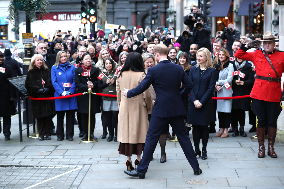 The Duke and Duchess of Sussex are seen surrounded by fans in front of Canada House. Source: Yui Mok/PA Wire