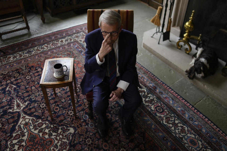 Ohio Gov. Mike DeWine pushes his glasses up on his nose as during an interview with The Associated Press at the Ohio Governor's Residence in Columbus, Ohio, Thursday, Dec. 21, 2023. (AP Photo/Carolyn Kaster)