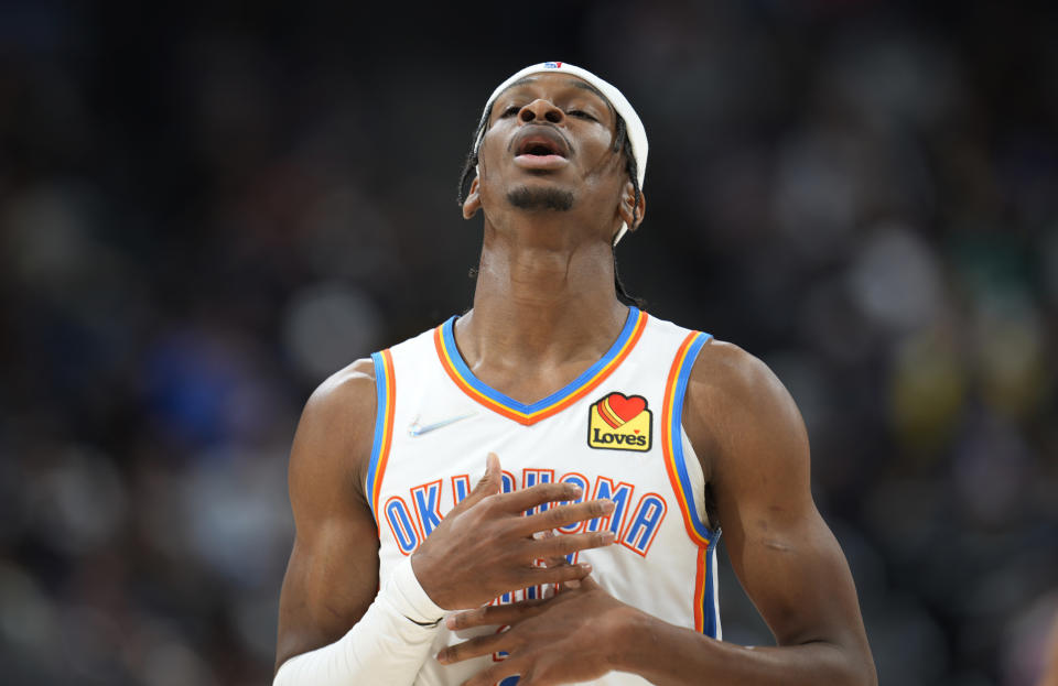 Oklahoma City Thunder guard Shai Gilgeous-Alexander catches his breath after hitting a basket against the Denver Nuggets during the second half of an NBA basketball game Wednesday, March 2, 2022, in Denver. The Thunder won 119-107. (AP Photo/David Zalubowski)