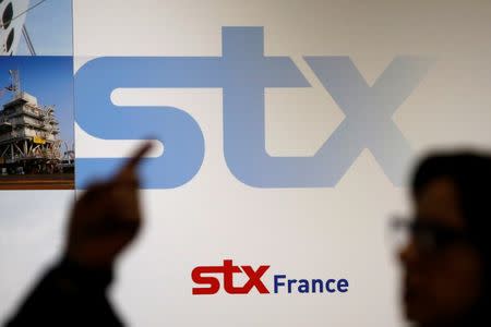 The logo of STX is seen during a press conference at the STX Les Chantiers de l'Atlantique shipyard site in Saint-Nazaire, western France, western France, January 4, 2017. REUTERS/Stephane Mahe