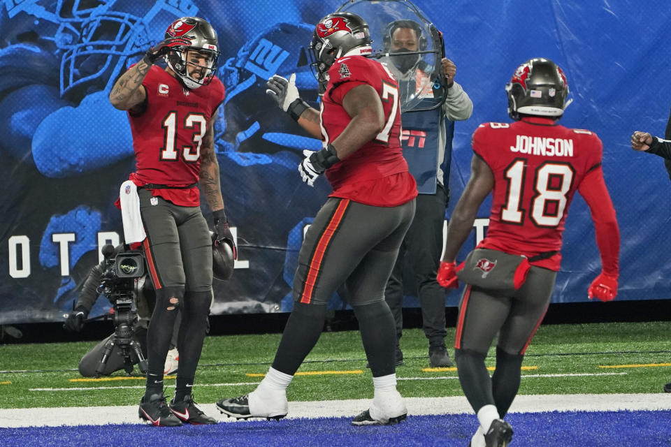 Tampa Bay Buccaneers' Mike Evans, left, celebrates his touchdown with teammates during the second half of an NFL football game against the New York Giants, Monday, Nov. 2, 2020, in East Rutherford, N.J. (AP Photo/Corey Sipkin)