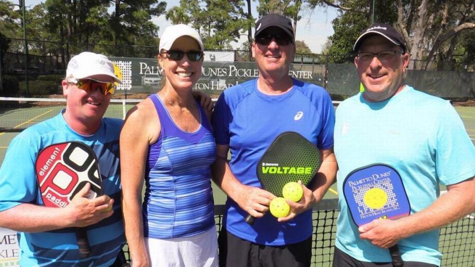 Palmetto Dunes Tennis Center tennis professionals, and pickleball players (from left) Scott Clements, Lindsay Ames and Brian Kiggans, and head pickleball pro Mark Anders, on one of the venue’s eight pickleball courts on March 14, 2016. Early last summer, the club did not have any courts devoted to the “exploding” sport, played by almost 2.5 million people nationally, according to the USA Pickleball Association.