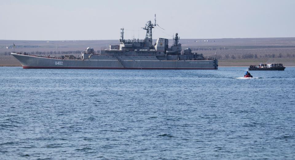 Ukrainian sailors leave the Konstantin Olshansky navy ship in the bay of Donuzlav, Crimea, on March 24, 2014.