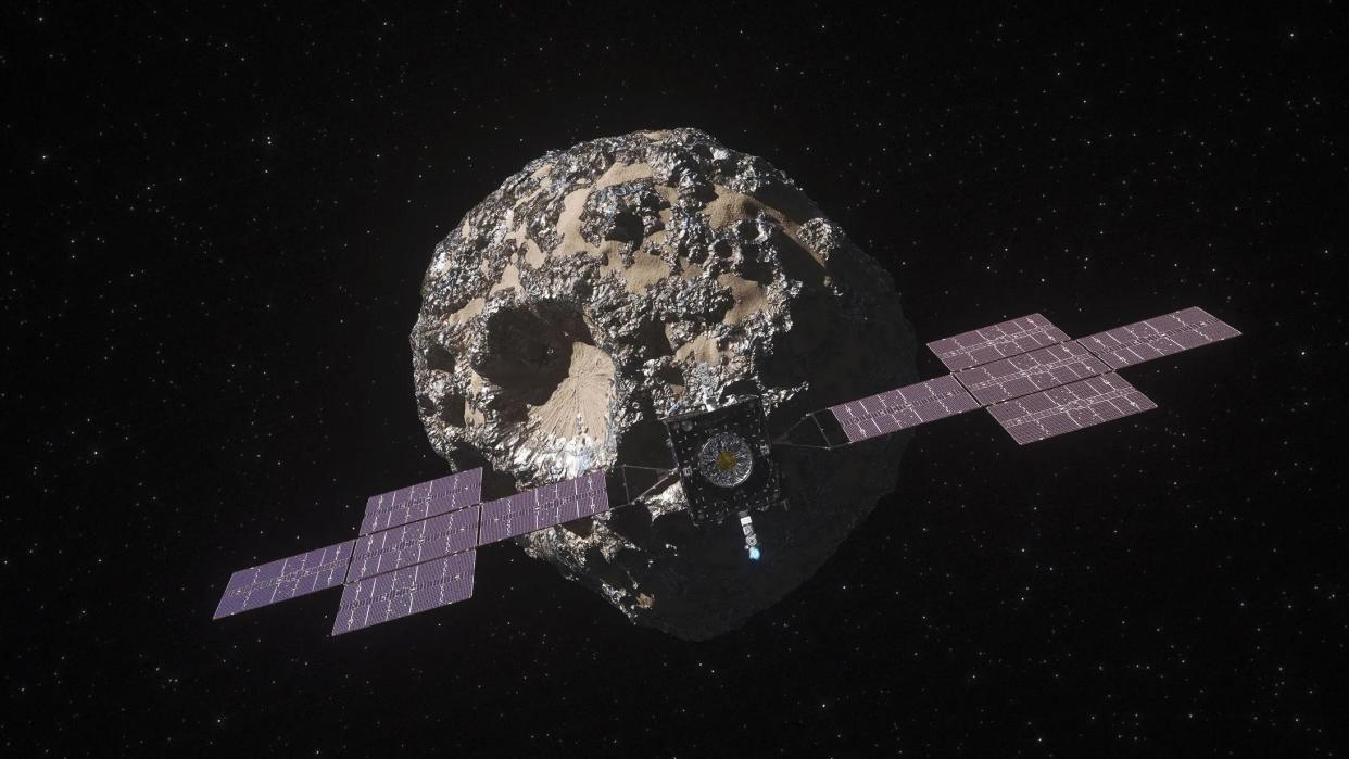 An illustration of NASA’s Psyche spacecraft approaching the asteroid.