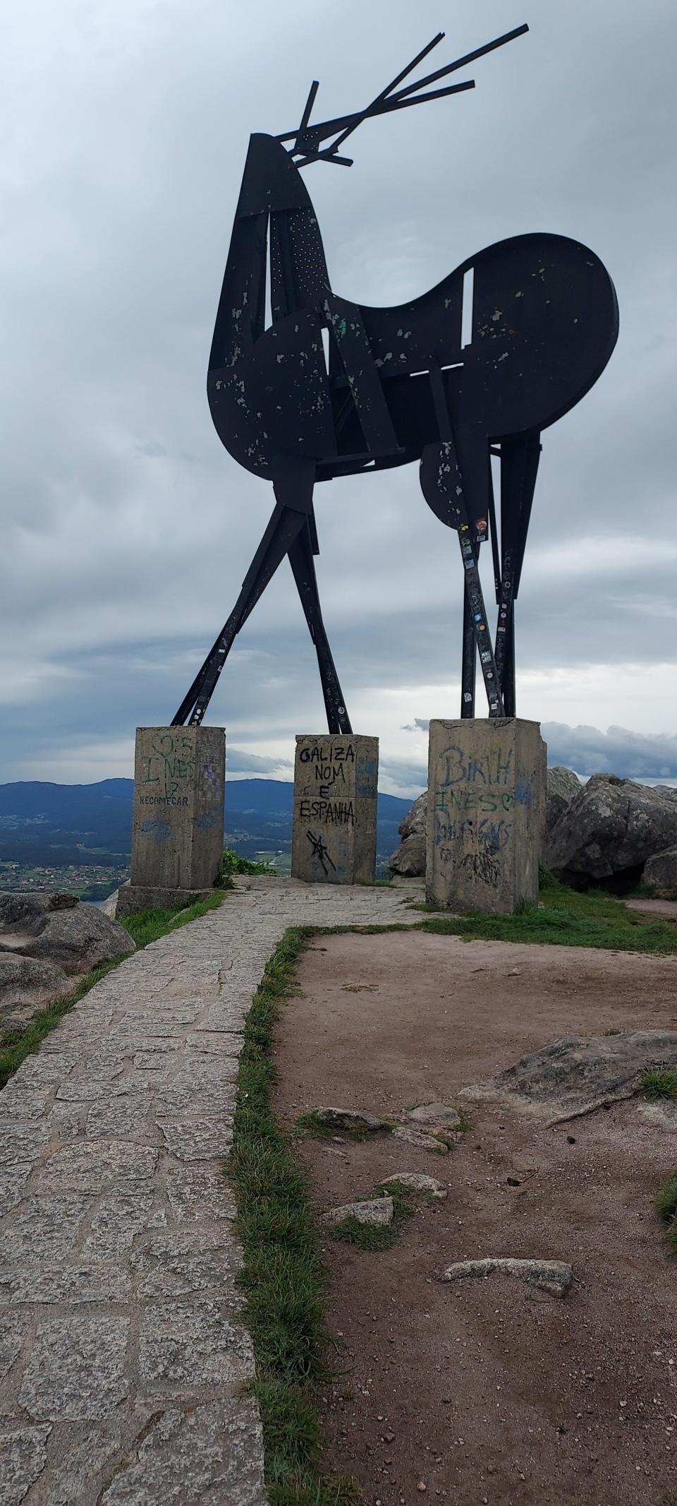 A large stag statue sits at the top of a high hill to Villa Nova De Cervera known as the village of the Portuguese stag along the Camino de Santiago.