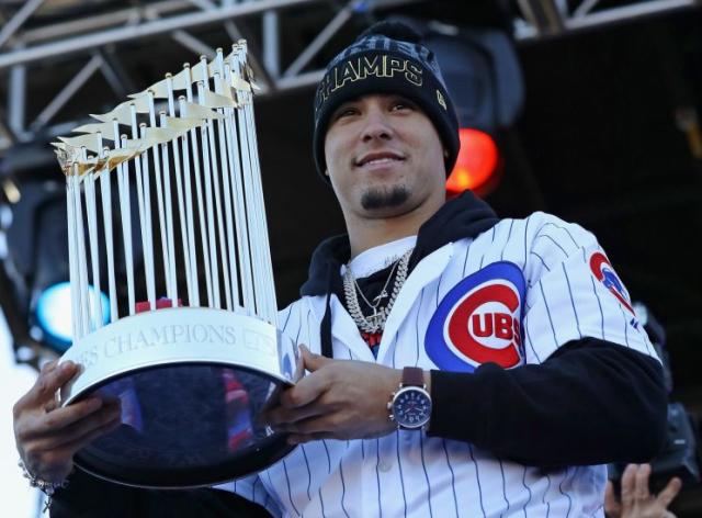 Javier Baez of the Chicago Cubs smiles at fans as he runs off the News  Photo - Getty Images