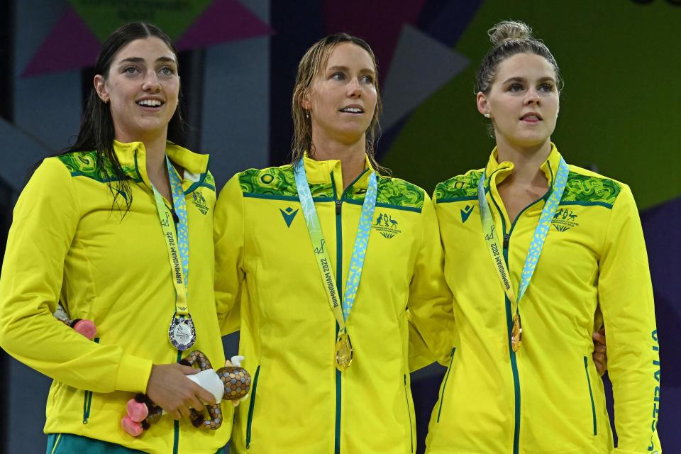 Meg Harris, Emma McKeon and Shayna Jack, pictured here celebrating their medals at the Commonwealth Games.