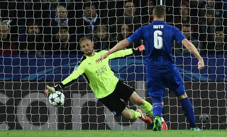 Leicester's 100 percent Champions League record was only preserved thanks to a last-minute save by Kasper Schmeichel (R), who batted away a close-range Andreas Cornelius (unseen) shot