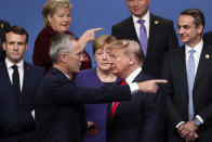 FILE - In this Dec. 4, 2019, file photo, NATO Secretary General Jens Stoltenberg, front left, speaks with U.S. President Donald Trump, front right, after a group photo at a NATO leaders meeting at The Grove hotel and resort in Watford, Hertfordshire, England. There will be leaders and populations who shudder at the thought of four more years of the Donald Trump administration and those whose consternation is tied to his potential defeat, and a U.S. government led by a President Joe Biden. (AP Photo/Francisco Seco, File)