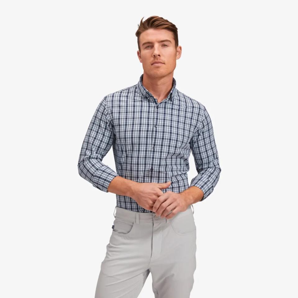 Model wearing a plaid stretch dress shirt.