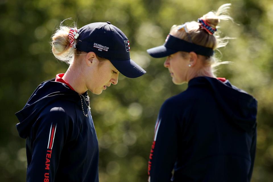 Americans Nelly Korda and Jessica Korda look on during a practice round ahead of the start of The Solheim Cup at Inverness Club in Toledo, Ohio.