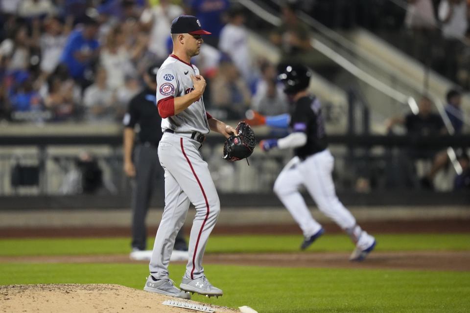 Washington Nationals' MacKenzie Gore waits as New York Mets' Pete Alonso runs the bases on a three-run home run during the fifth inning of a baseball game Friday, July 28, 2023, in New York. (AP Photo/Frank Franklin II)