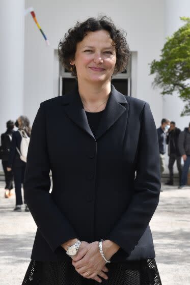 Cecilia Alemani, curator and artistic director of the 59th Biennale of Arts exhibition, poses for photos on its opening day.