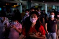 People wearing face masks are seen at a subway station in Shanghai