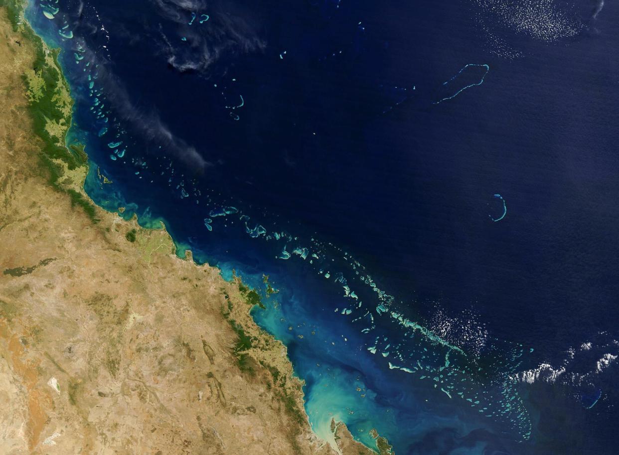 Stretching along more than 2,000 km (1,200 miles) of Australia’s eastern coast is one of the world’s formost natural wonders - The Great Barrier Reef (Light blue) seen here in this 06 August, 2004 NASA satellite image. (AFP via Getty Images)