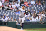 Los Angeles Dodgers third baseman Justin Turner throws to first to put out Washington Nationals' Josh Bell during the second inning of a baseball game, Wednesday, May 25, 2022, in Washington. (AP Photo/Nick Wass)