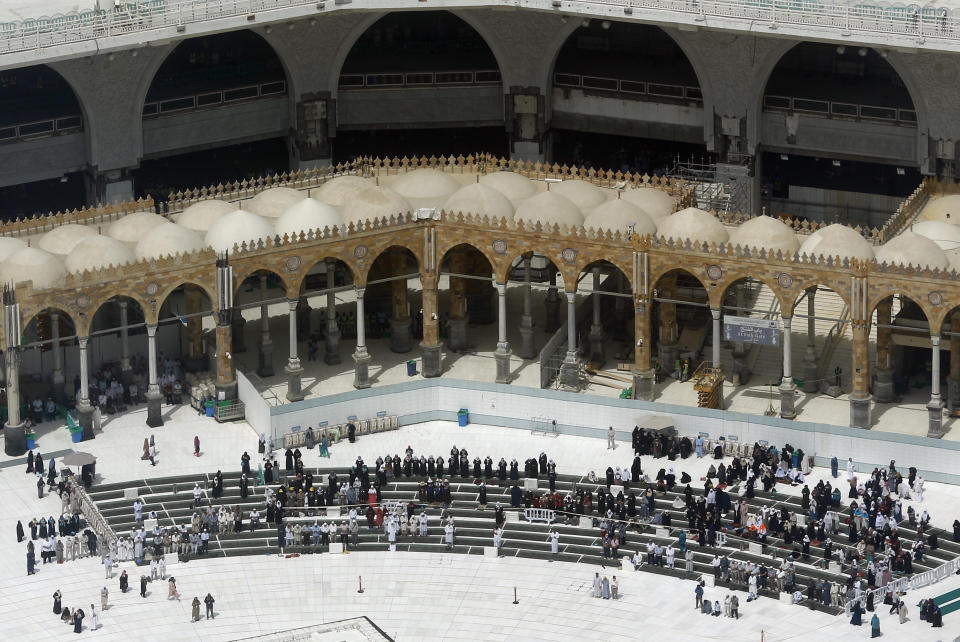 A relatively few number of Muslims pray at the Grand Mosque, in the Muslim holy city of Mecca, Saudi Arabia, Wednesday, March 4, 2020. On Wednesday, Saudi Arabia's Deputy Health Minister Abdel-Fattah Mashat was quoted on the state-linked news site Al-Yaum saying that groups of visitors to Mecca from inside the country would now also be barred from performing the pilgrimage, known as the umrah. (AP Photo/Amr Nabil)