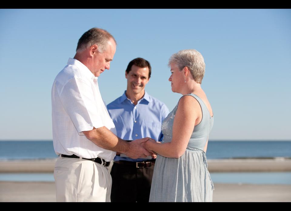 David and Trish Palmer say "I do" on a beach in Hilton Head, South Carolina. One of Trish's co-workers, Mike Hinkes, married the pair.