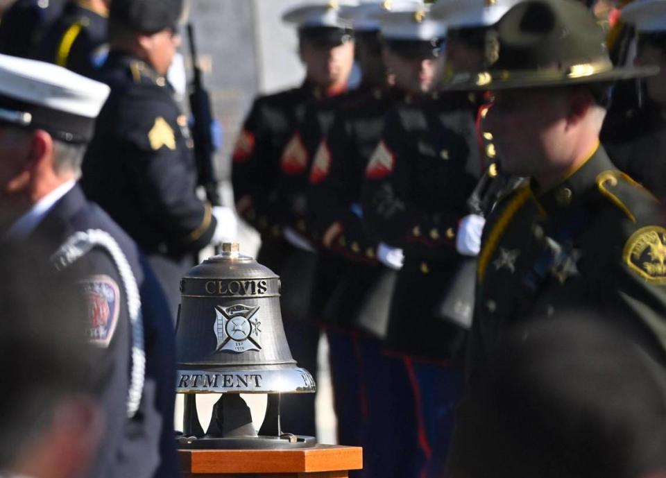 The ceremonial fire bell is seen as fire, police and military staff file past at the California 9/11 Memorial Monday morning, Sept. 11, 2023 in Clovis.