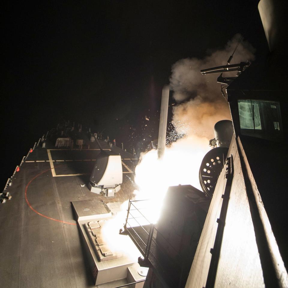 Image released by US Navy shows a Tomahawk missile being launched from a warship in the Mediterranean Sea - Credit: ROBERT S. PRICE/AFP