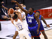 Argentina's Luca Vildoza (17) looks to pass as United States' Draymond Green (14) defends during the second half of an exhibition basketball game in Las Vegas on Tuesday, July 13, 2021. (Chase Stevens/Las Vegas Review-Journal via AP)